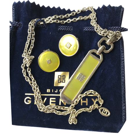 gold givenchy necklace|Givenchy necklace and earring set.